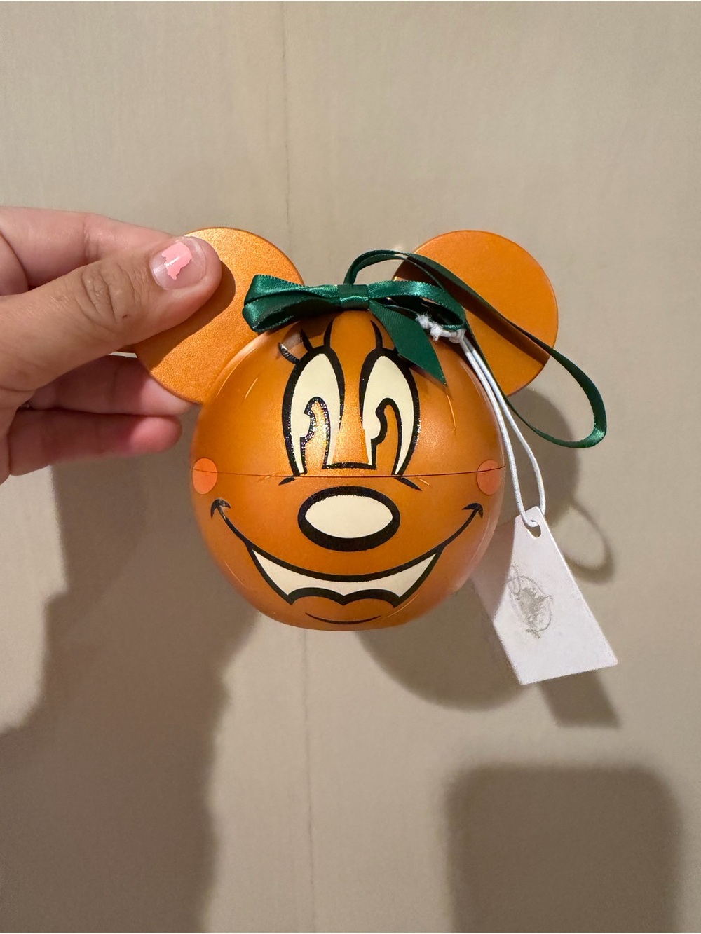 Disney-Inspired Orange Mickey Pumpkin Ornament with gold necklace and earrings